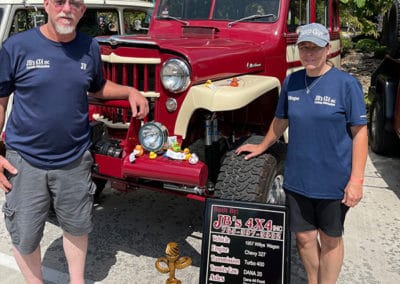 2021 Award winner couple with crimson and cream colored classic Jeep