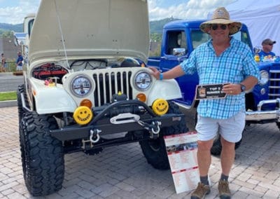 Man with white Jeep who was a Top 5 finisher in the Show and Shine